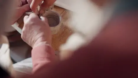 Top view hands and pottery clay process in art