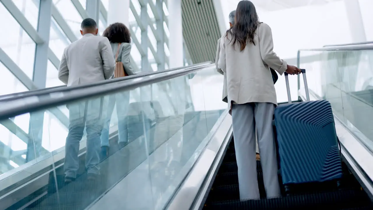 Airport suitcase and the back of business people