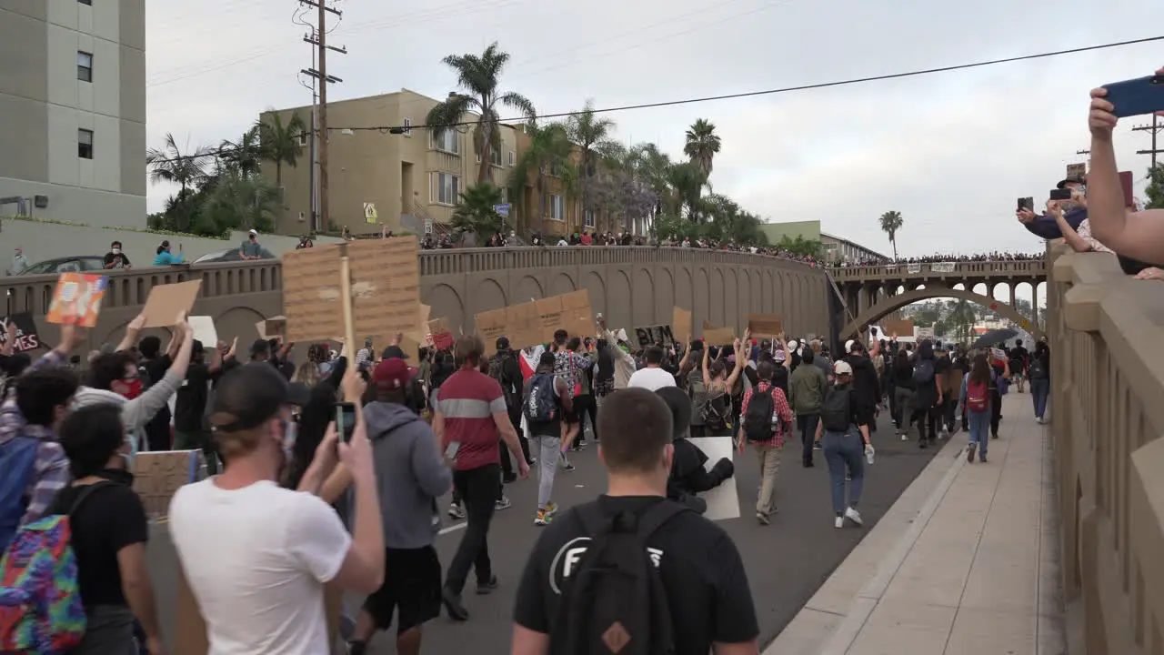 Hundreds of protesters hold signs and chant during a black lives matter protest North Park San Diego CA