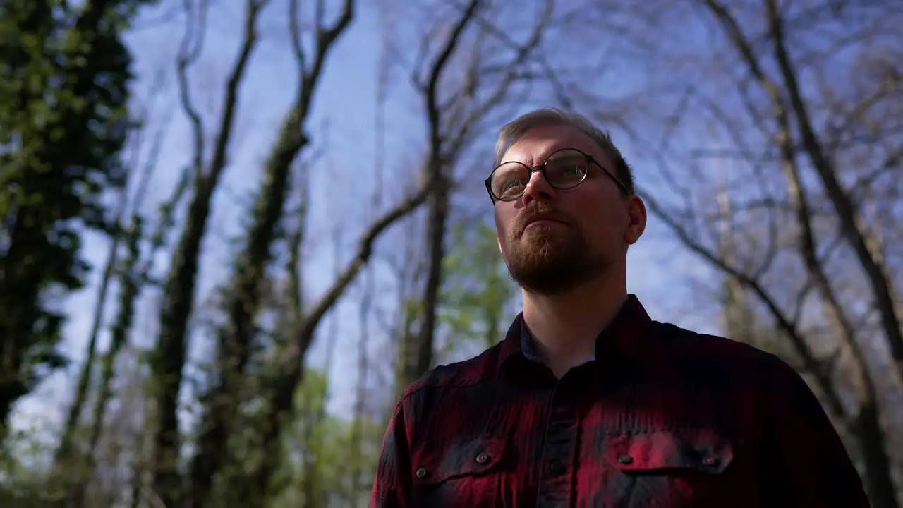 Confident Serious Man with Beard and Glasses Parallax Medium Shot in Nature