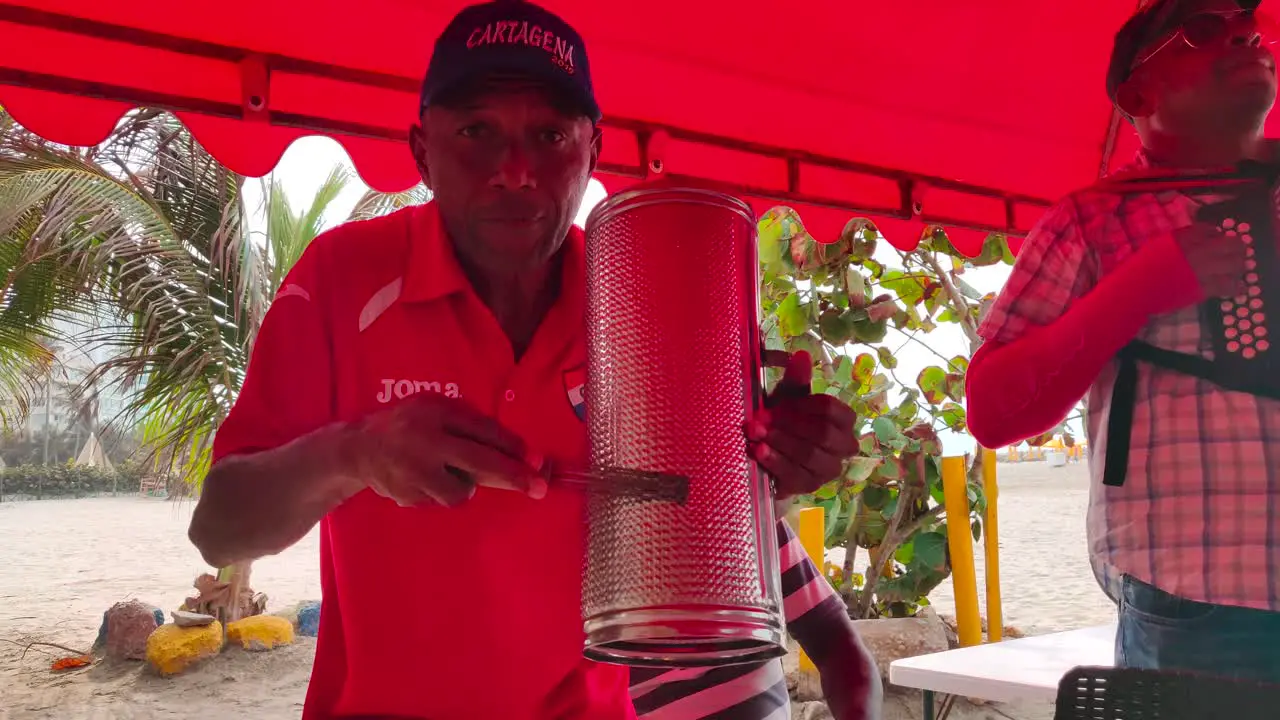 A band of Vallenato music is playing on a beach of Cartagena de Indias Colombia