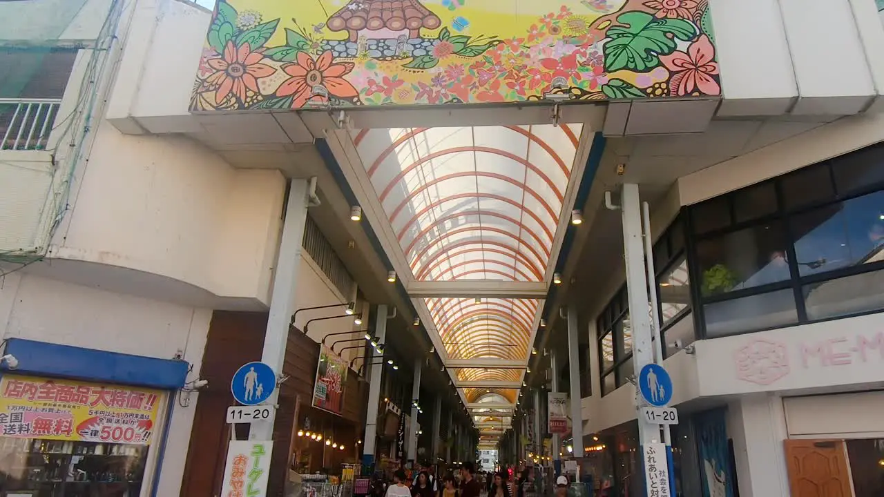 Tilt Up Shot of tourist shopping for souvenirs in Euglena Mall