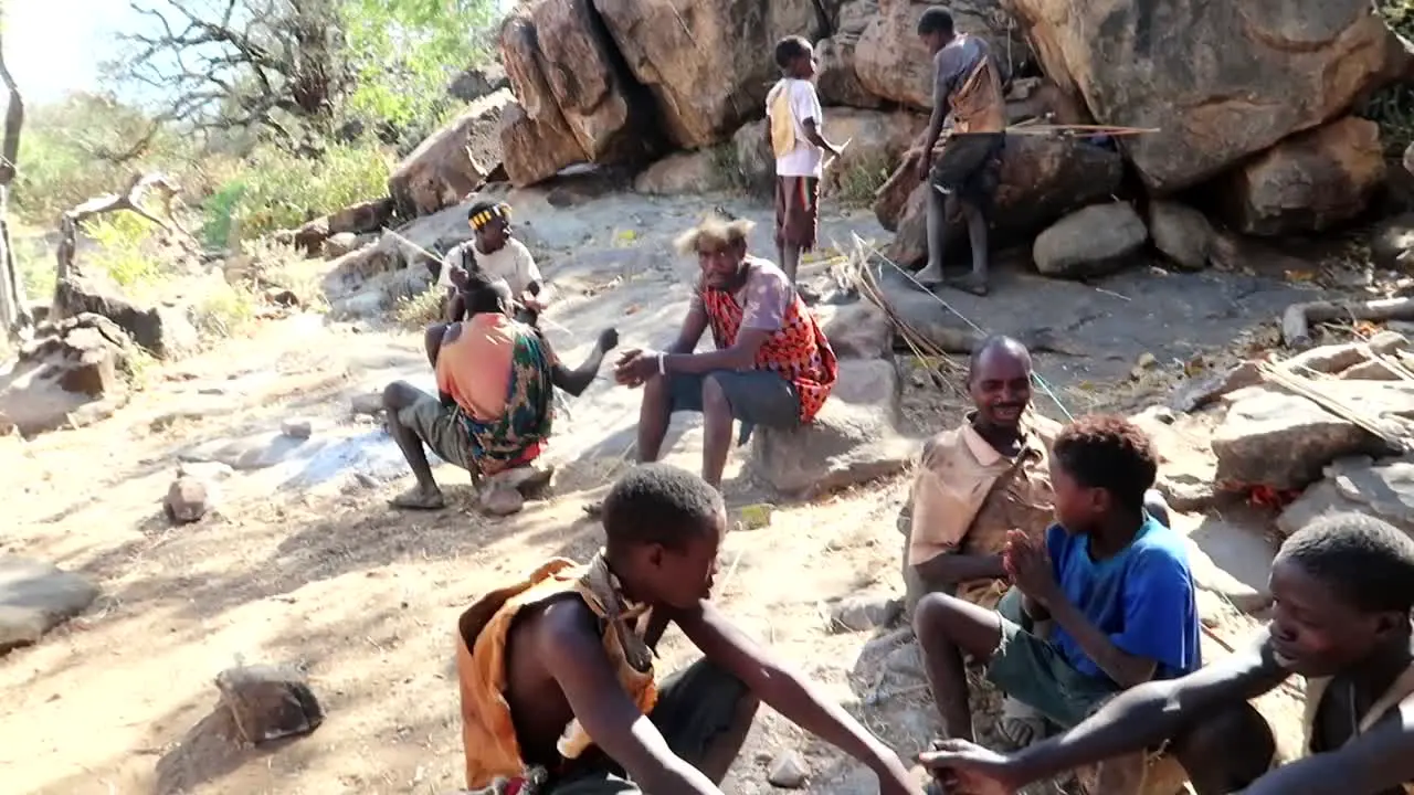 Hadzabe African tribe getting warm with ashes in the outdoor