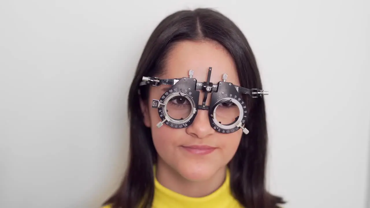 little girl trying on lenses for her glasses