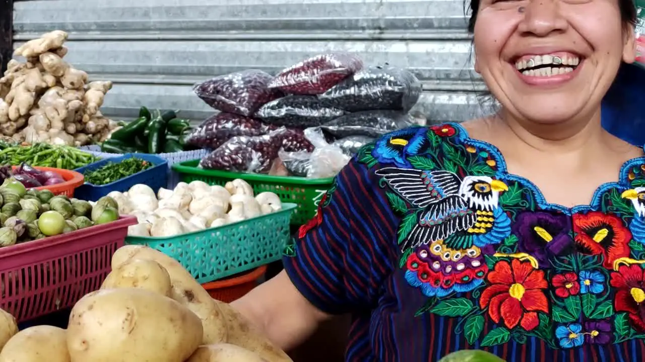 Mayan woman from Antigua Guatemala smiling Native vegetable