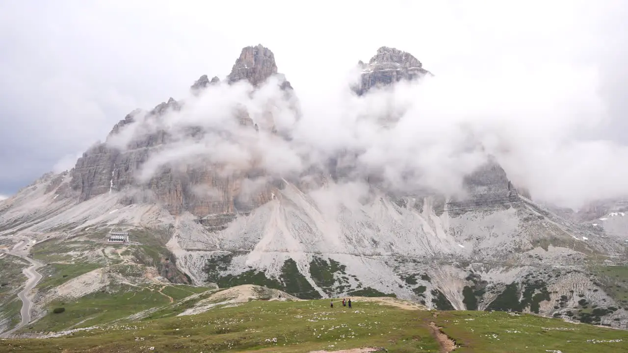 Fog and clouds gather around Tre Cime di Lavaredo in Auronzo Valley Dolomites Italy