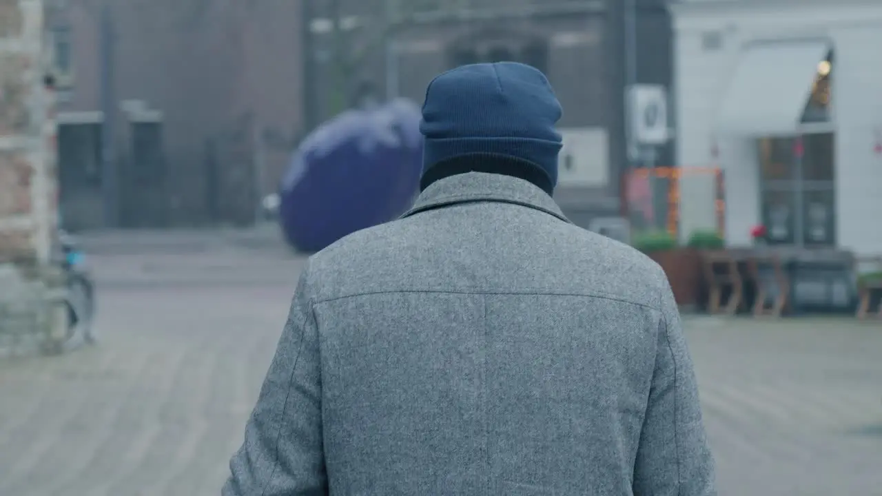 Man walking down the streets of Rotterdam The Netherlands