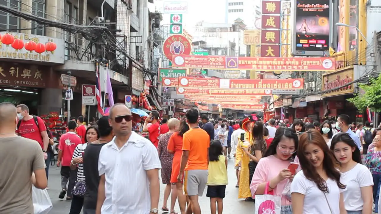 Large Crowd Of Thailand People At Street Festival In Bangkok