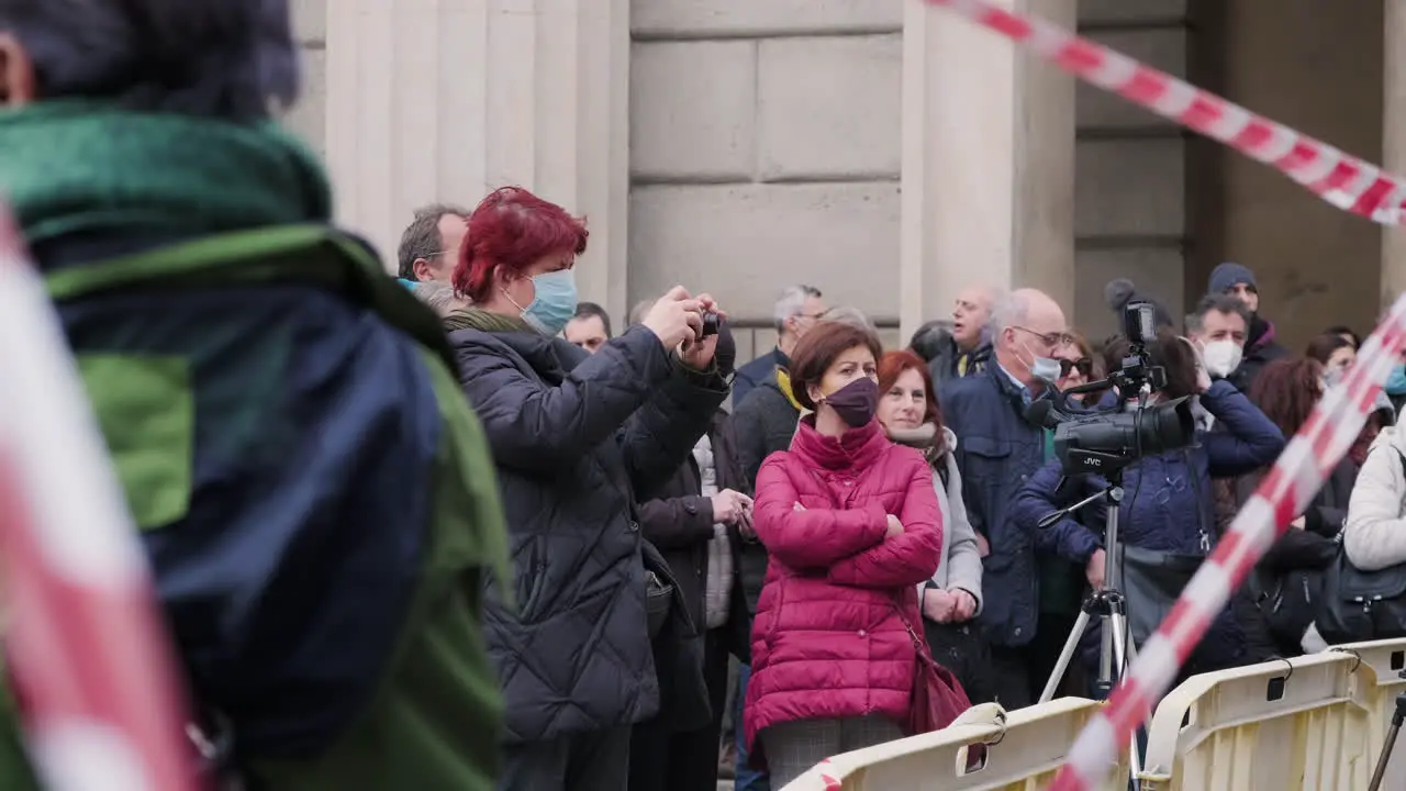 Group Of People Listening And Filming The Protest Demonstration Against The Italian Government At Piazza XXV Aprile Amidst The Pandemic Outbreak In Milan Italy