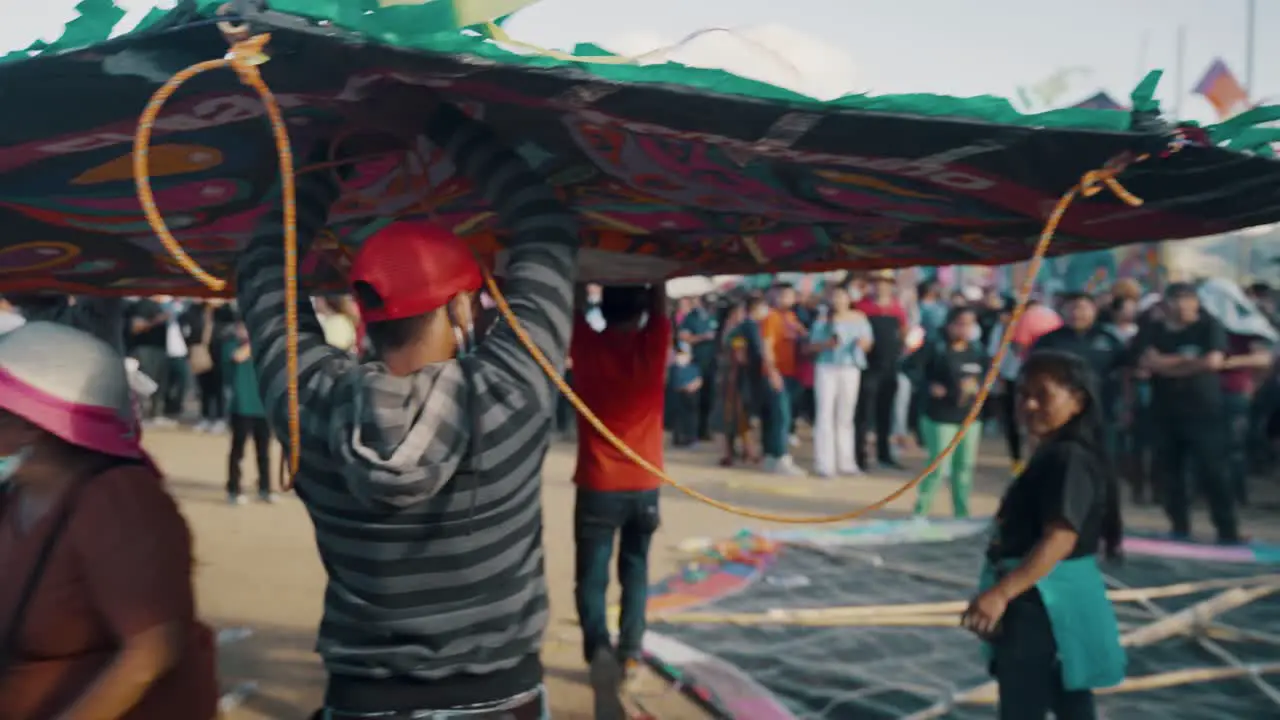 Group Of Men Carrying A Giant Kite During Sumpango Kite Festival In Sumpango Sacatepéquez Guatemala