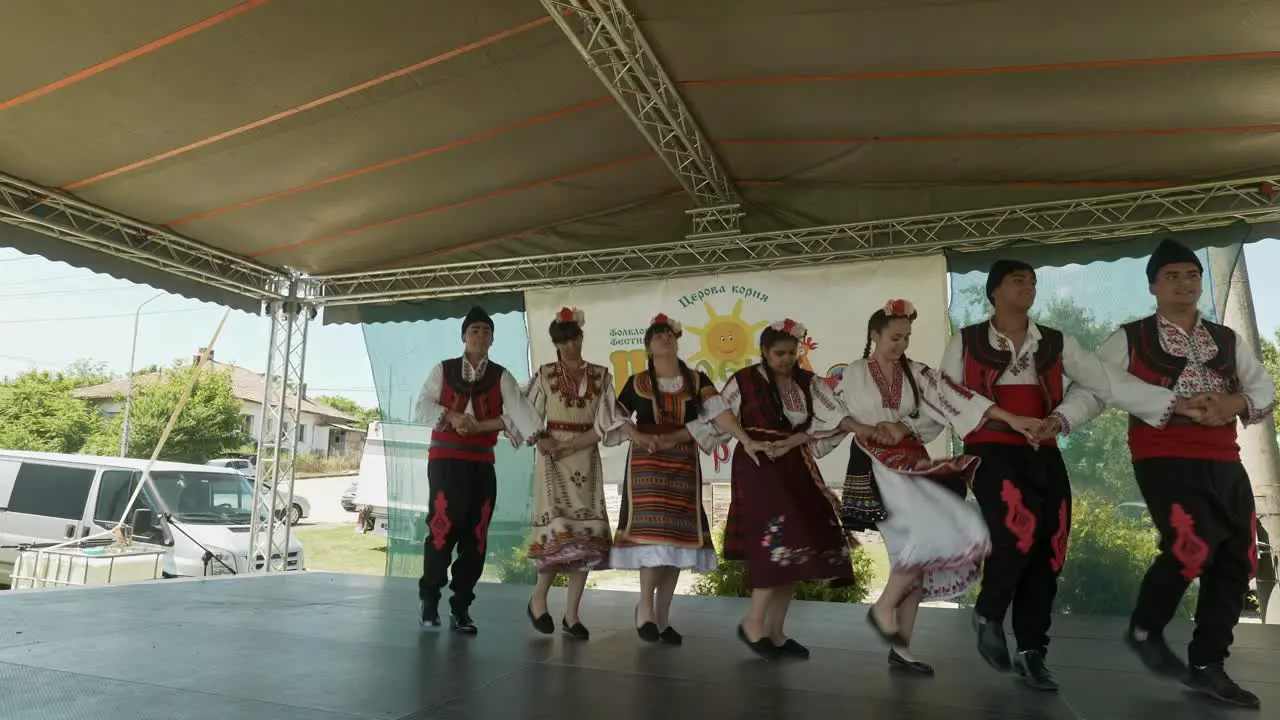 Folklore Dance group on festival stage performing Bulgarian Hero