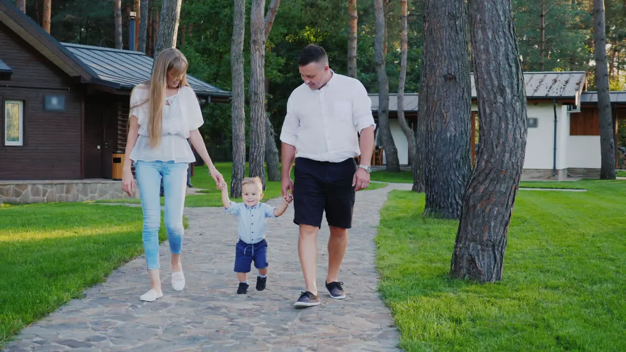 Mom and Dad Walking With Young Son