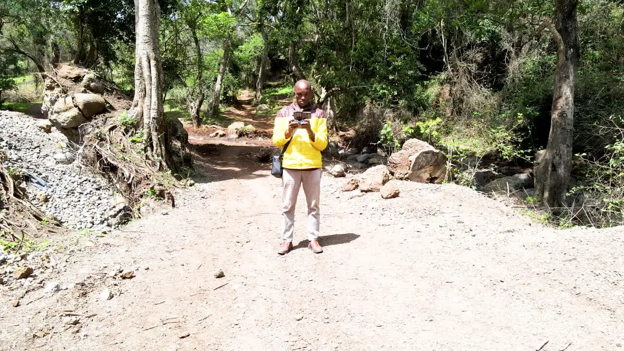 Airplane industrial UAV innovative drone pilot taking drone photography operating security drone in the forest of Kenya