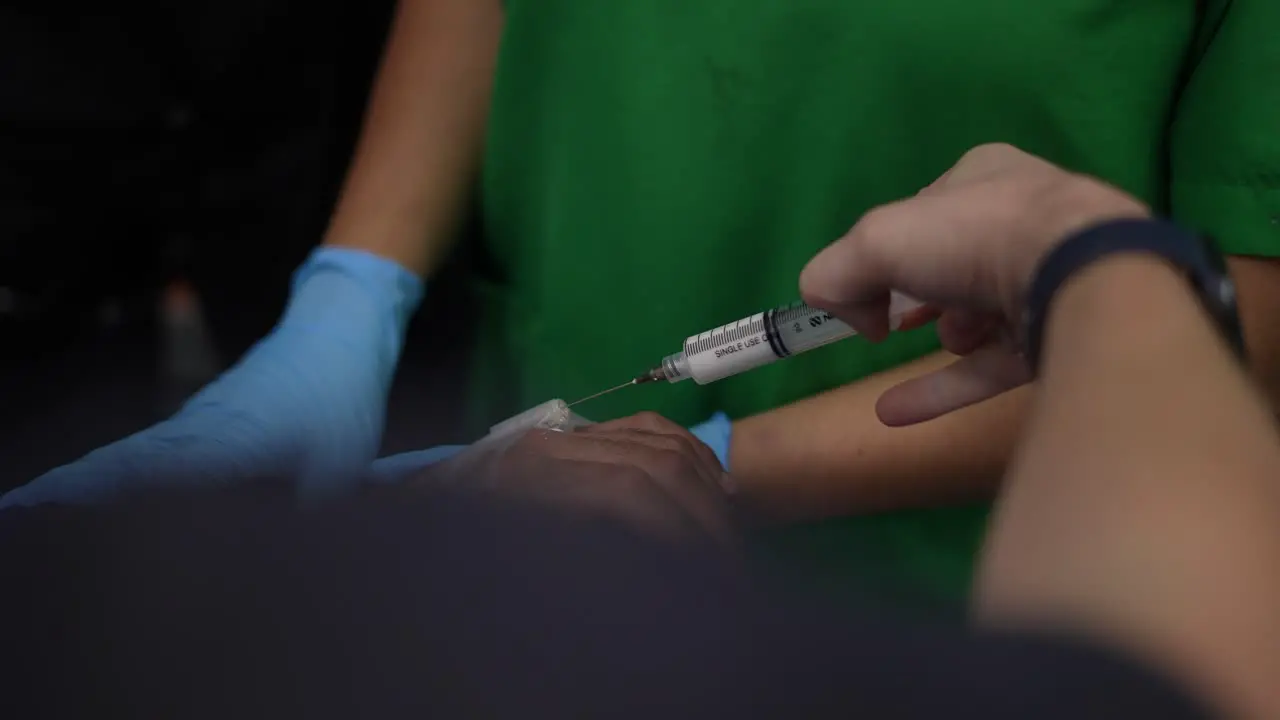 placement of anesthesia on the patient's hand operating room hospital clinic