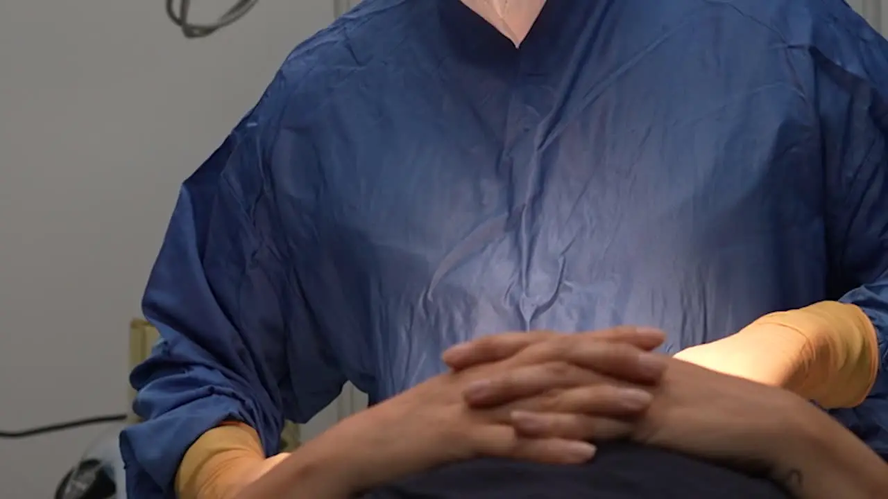 jowl liposuction surgery in operating room doctor operating on face cosmetic surgery