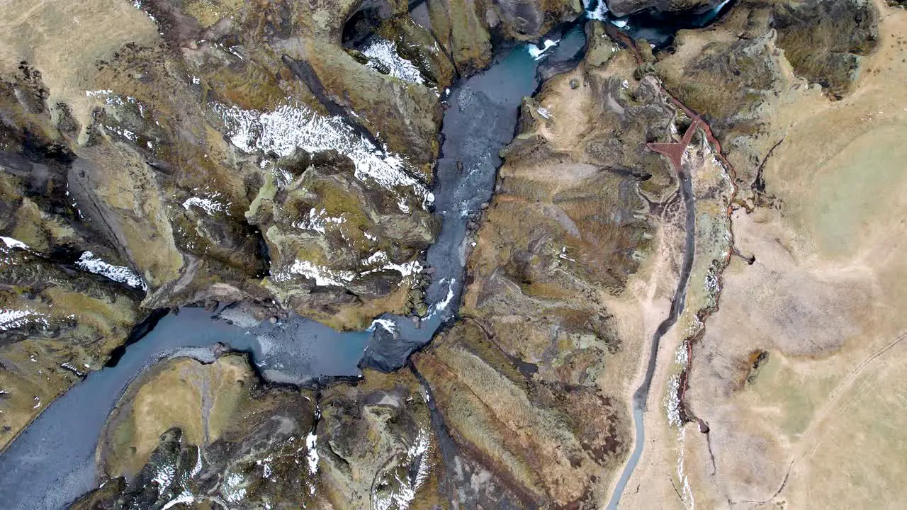 Drone rotating flying over winding River Canyon in Southern Iceland Countryside off Iceland Ring Road