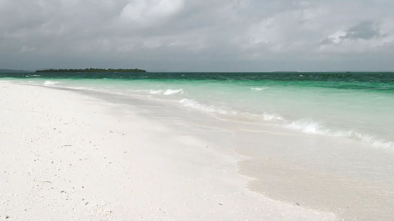 Awesome shot of white sandy beach and turquoise ocean in zanzibar at overcast day tanzania