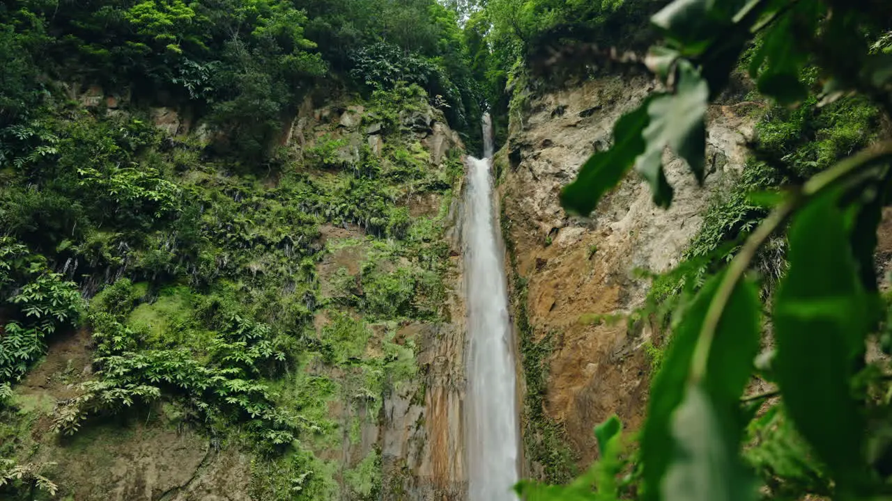 Slow motion close up shot of Ribeira Quente natural waterfall in Sao Miguel in the Azores Portugal