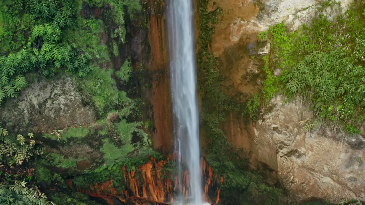 Cinematic Aerial Drone shot of Ribeira Quente natural waterfall in Sao Miguel in the Azores Portugal