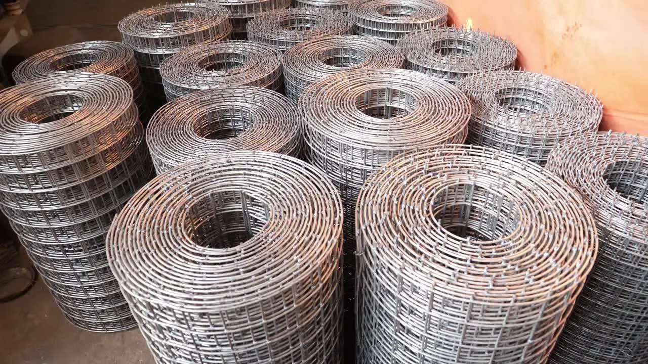 Stacked Wire Mesh Rolls On Floor Circle Dolly