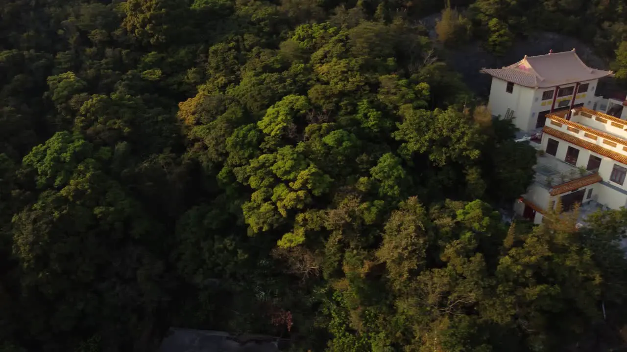 Sideways Drone Reveal of a Golden Temple in Hong Kong