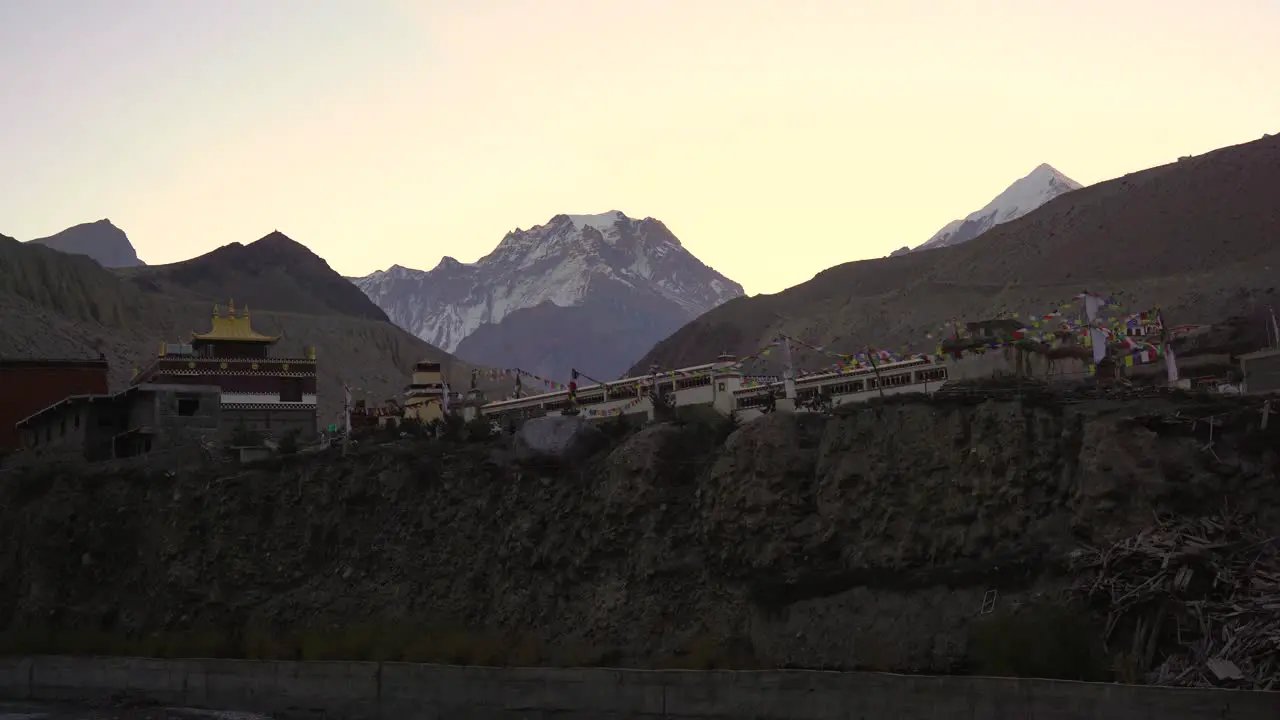 A view of the Buddhist temple in Kagbeni Nepal with the prayer flags waving in the wind