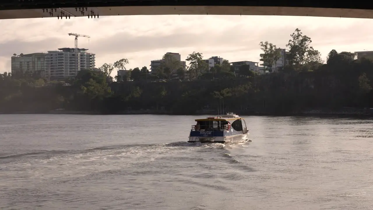 Brisbane river ferry with Kangaroo Point in the background in the early morning