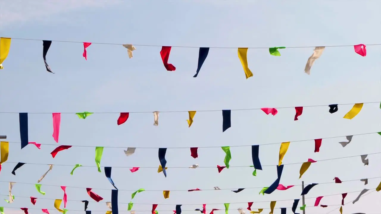 Various colorfull ribbons tangled up in the sky fluttering view from under ribbons