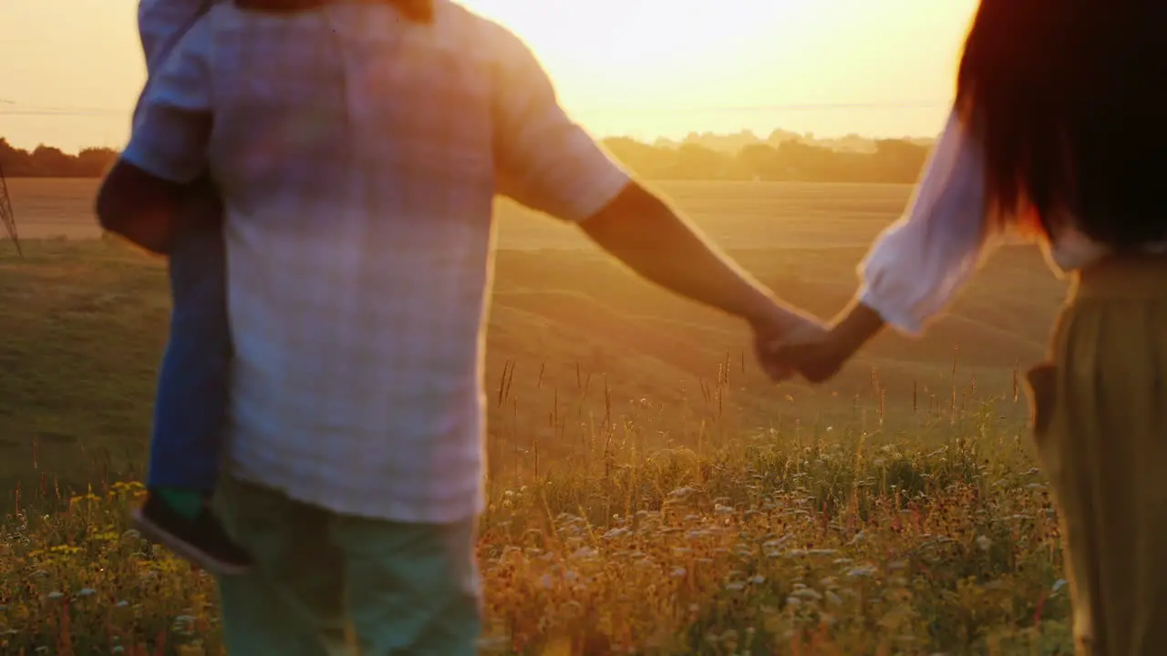 A Young Farming Family With Children Goes To Meet The Sun Sunset