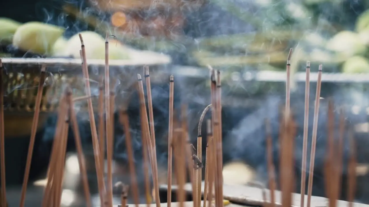 Close up of incense burning outside Asian temple