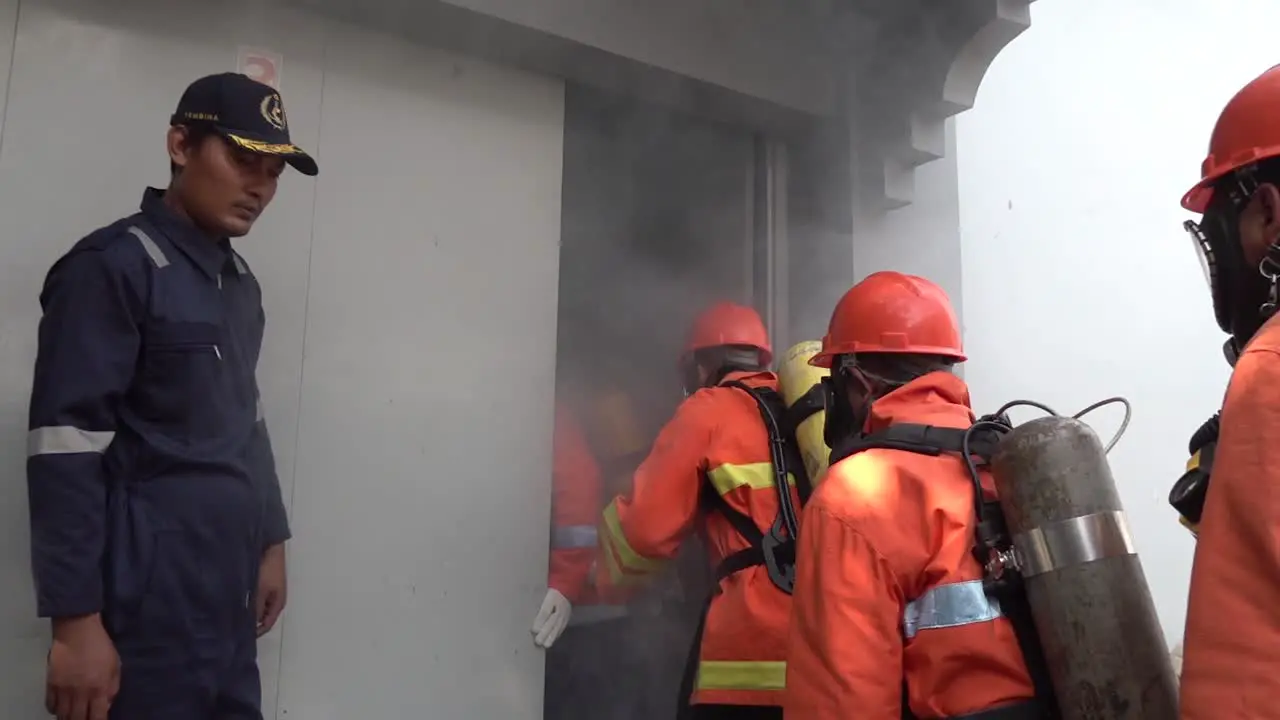 West Java Indonesia December 1 2021  Strong and Brave Firefighters enter the smoky building to rescue victims