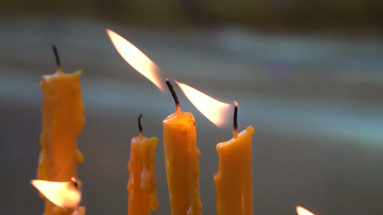 burning candles at a temple in northern Thailand