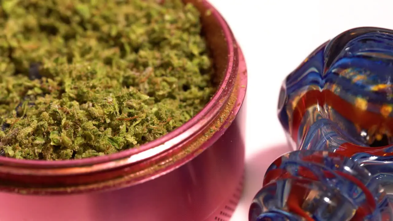 Pan across marijuana grinder and glass pipe