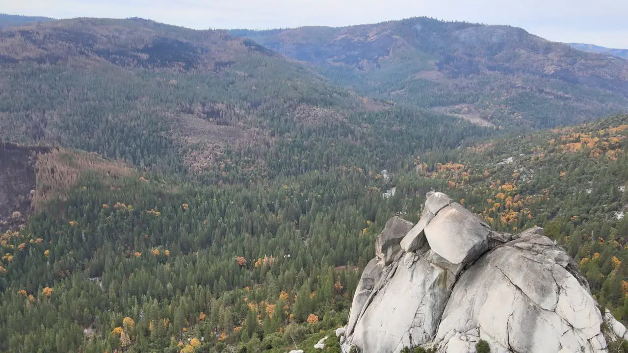 Drone shot panning from right to left over Sugarloaf rock in Kyburz Ca in El Dorado county