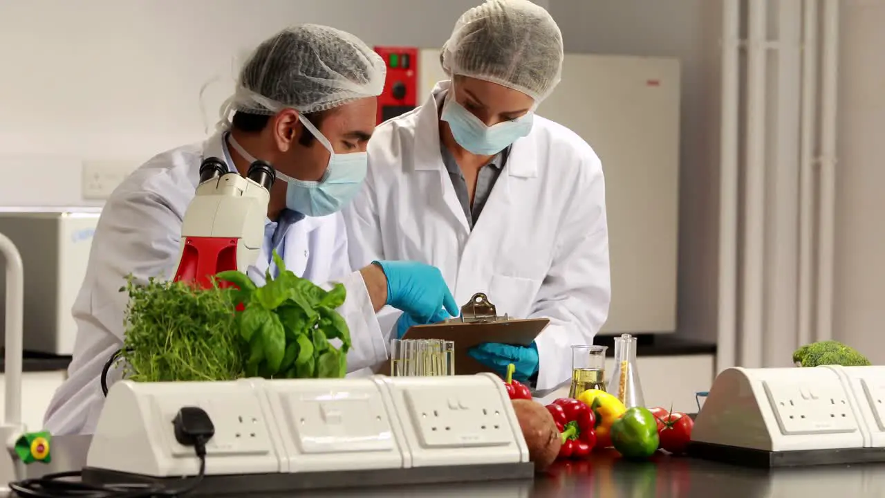 Scientists experimenting on food together