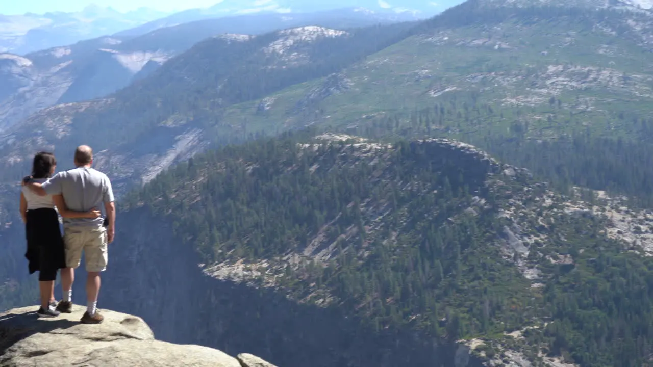 4K Tourist Couple On Vacation Overlooking Glacier Point in Yosemite National Park California