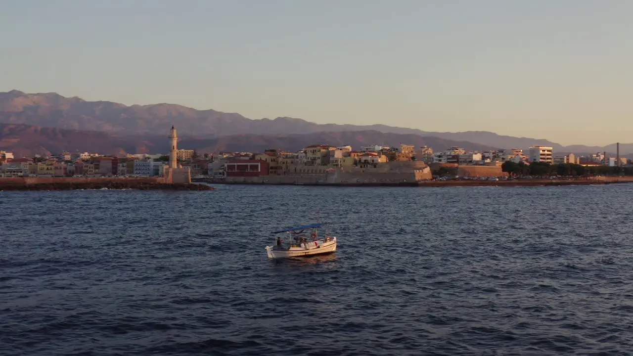 Aerial Small fishing boat floating in Chania Greece