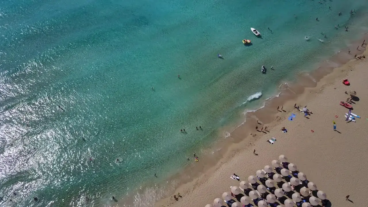 Drone view of white sand beach with tourists in Falassama beach Crete Greece