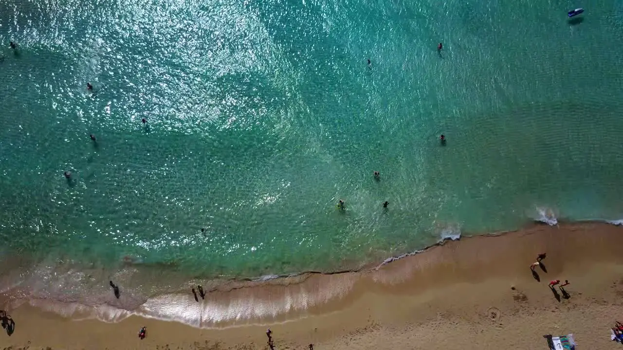 Drone view of white sand beach umbrellas and tourists in Falassama beach Crete Greece