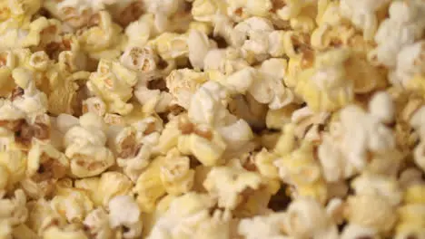 Fresh hot popcorn mixing popcorn machine Popcorn background