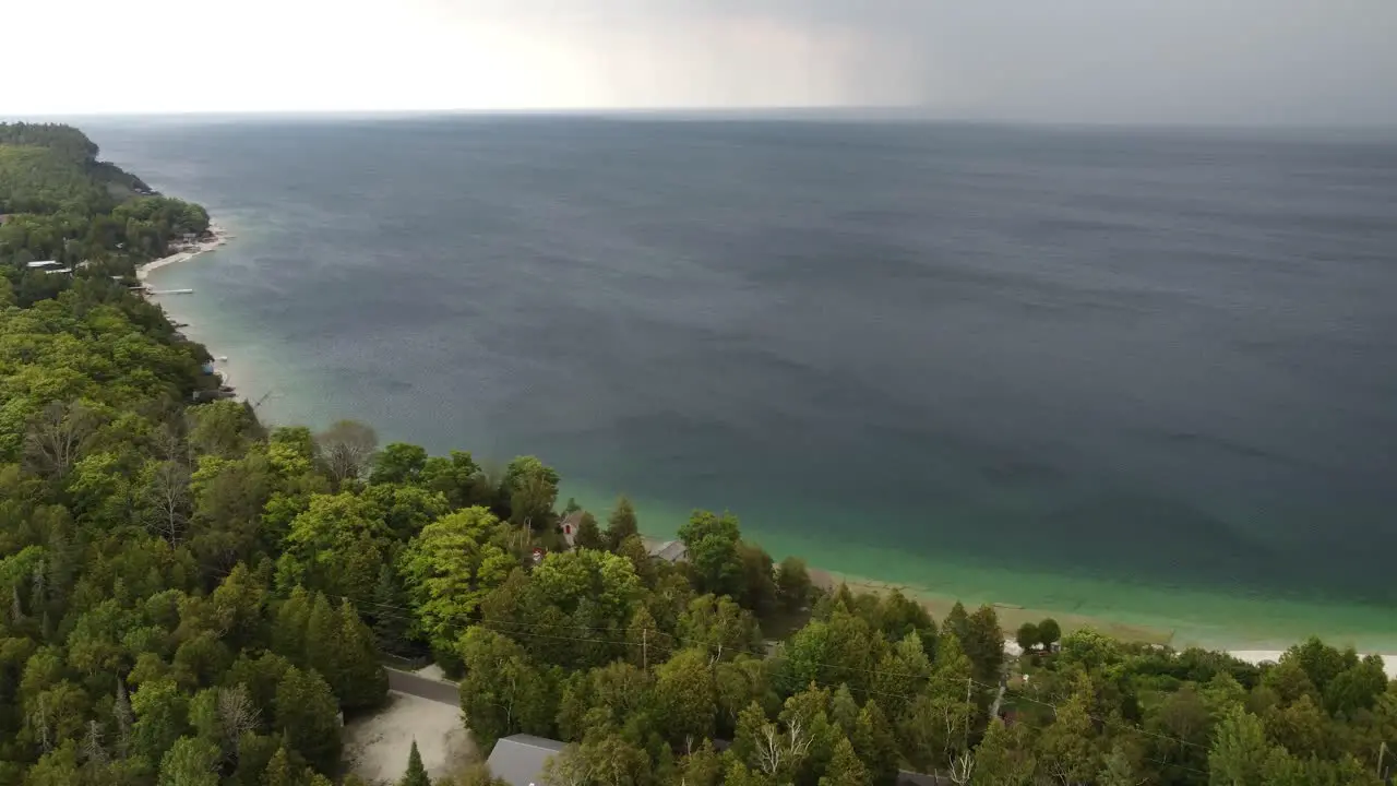 Big rain shower over Lake Huron in Ontario canada approaches lakeside