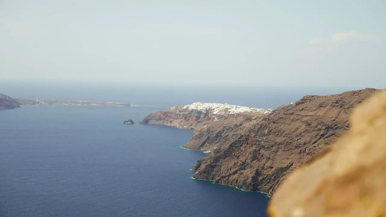 Steep cliffs drop into the Mediterranean Sea on the island of Santorini Greece