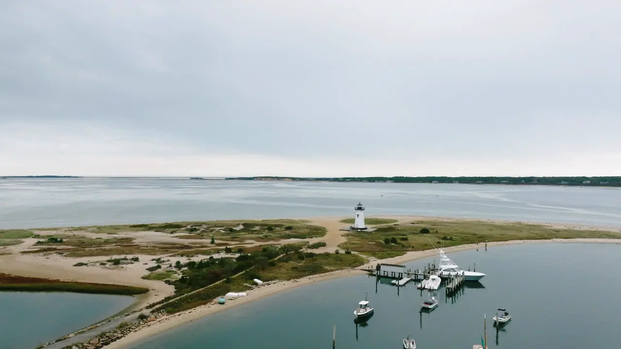 Aerial drone approaching Edgartown Lighthouse Martha's Vineyard over harbor