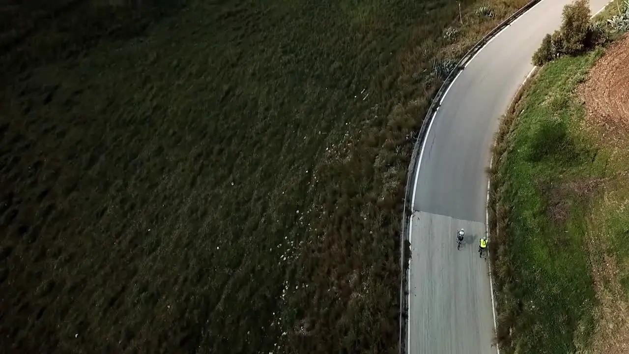 Two men riding their bicycles Drone view