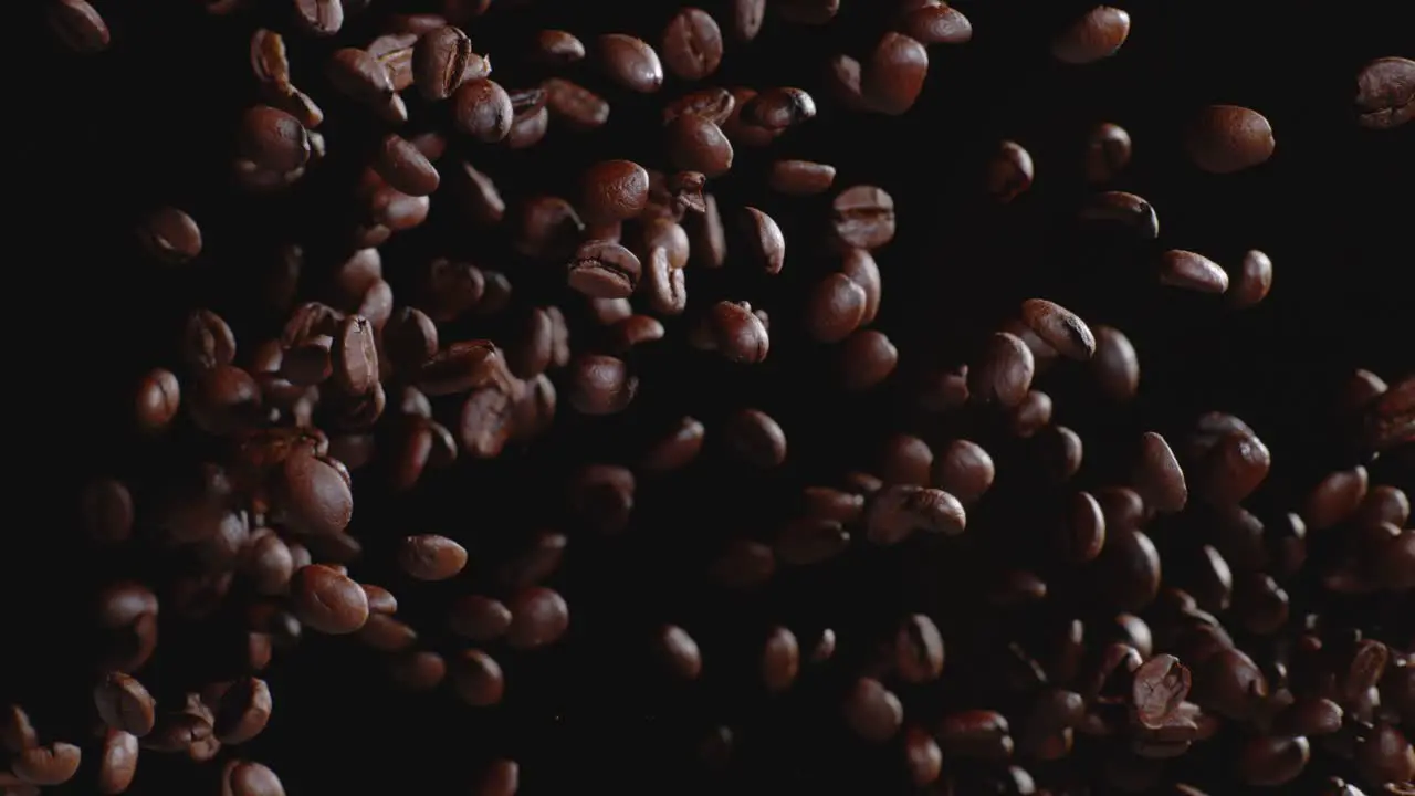 Coffee beans tossed in air slow motion