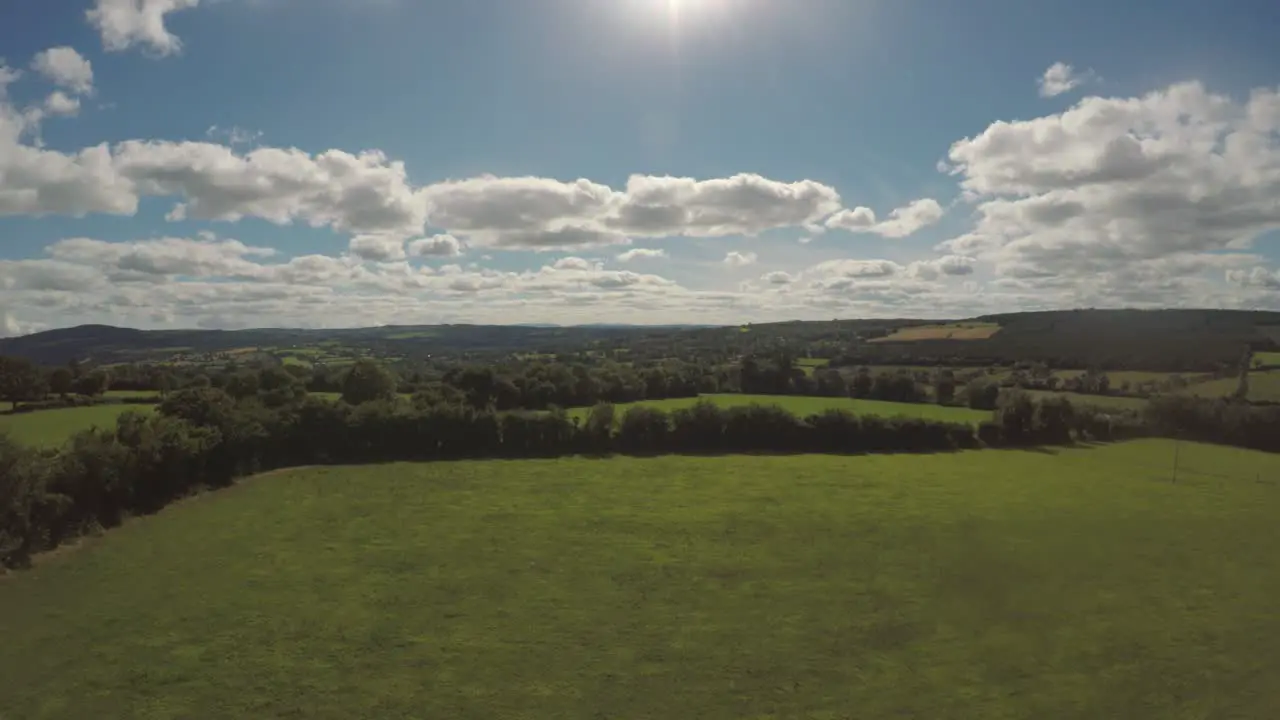 Slowly flying out over the beautiful green rolling fields of Ireland