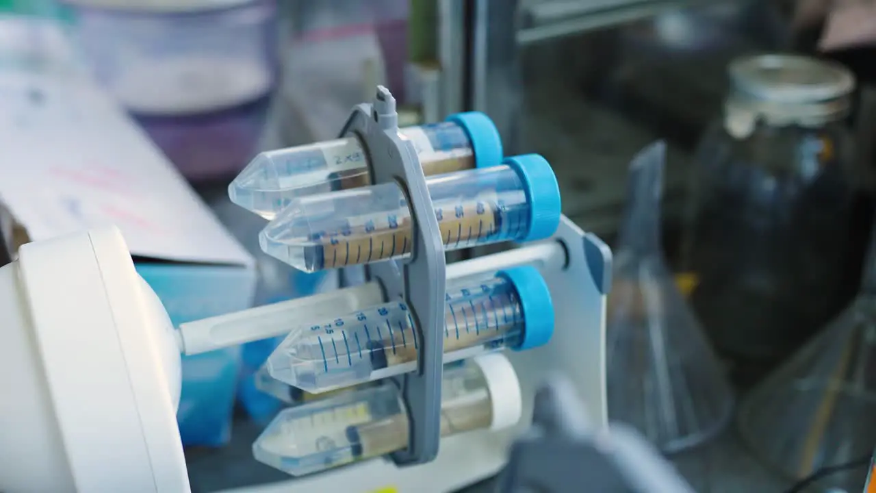 Test tubes spinning in a rotator during a science experiment in a lab