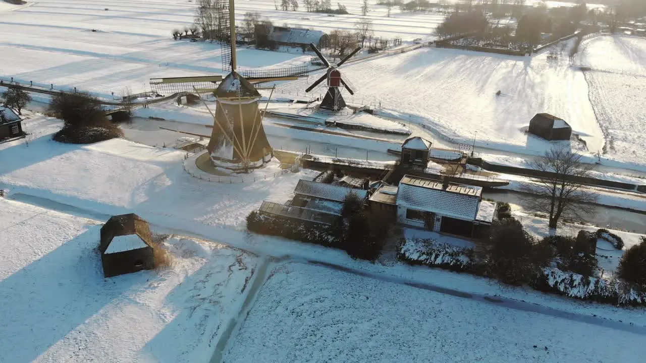 Droneshot of a typical Dutch landscape with traditional windmills