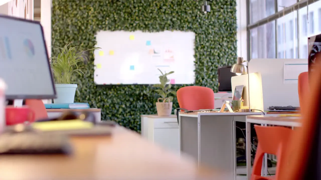 Office interior with green wall and whiteboard slow motion