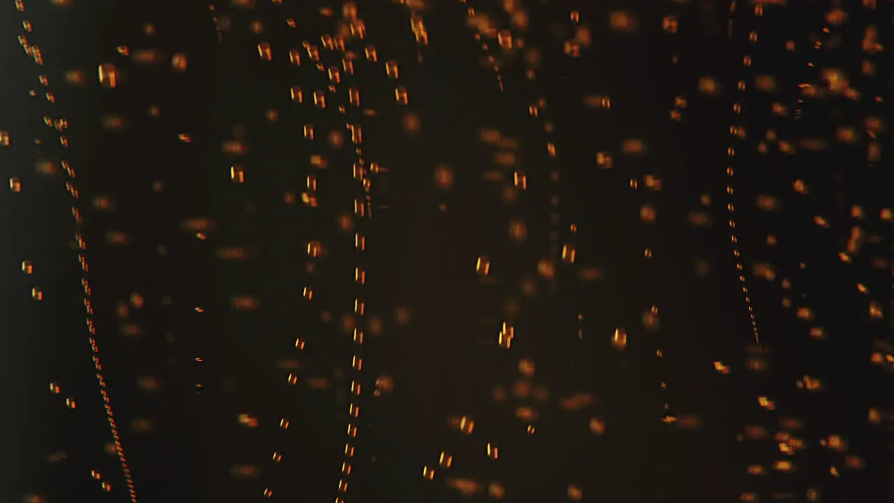 Macro shot of ascending red bubbles underwater